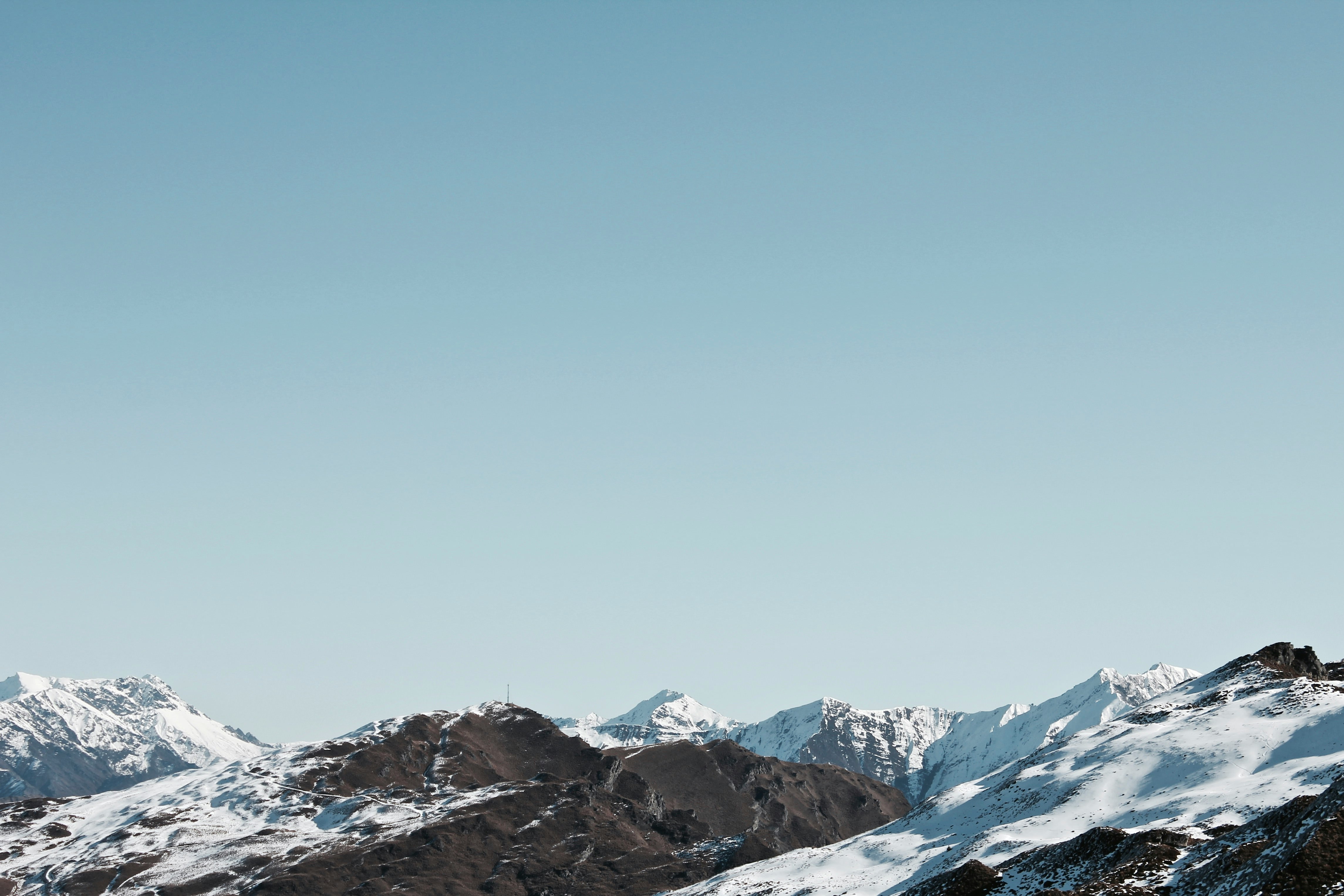 photo of mountain covered by snow during daytime